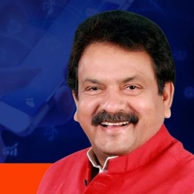 Smiling portrait of Satyapal Singh Baghel in a red jacket